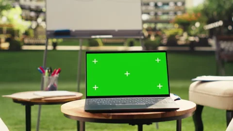 Green screen laptop placed on table in empty office terrace modern workspace Stock Footage 338379684