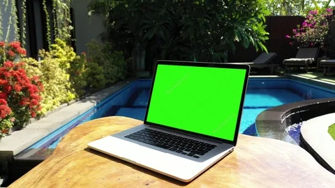 Green Screen Laptop by the Pool Stock Footage 119808153