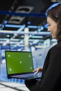 Green screen laptop, server virtualization and developer in data center Stock Photos