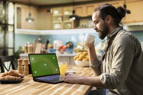 Green screen on laptop, solving daily tasks, wireless computer work Stock Photos