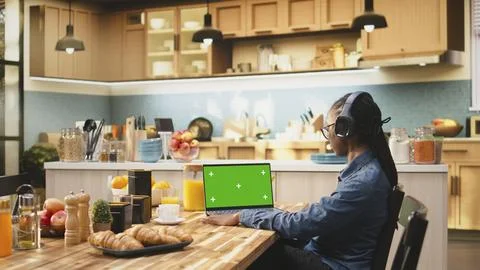Green screen on laptop, solving daily tasks, wireless hybrid work Stock Photos