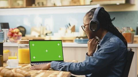 Green screen on laptop, solving daily tasks, wireless hybrid work Stock Photos