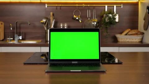 Green screen laptop standing on kitchen table, computer with chroma key display Stock Footage 167518065