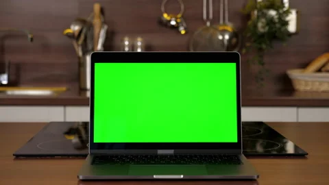 Green screen laptop standing on kitchen table, computer with chroma key display 스톡 동영상 168246231