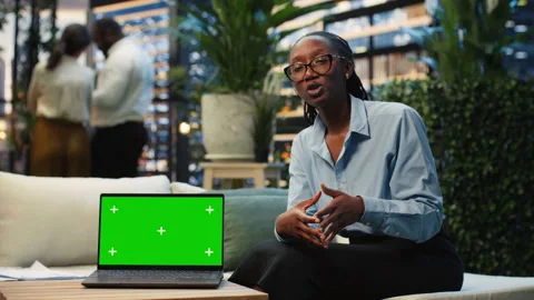 Green screen laptop on table used by businesswoman to do project Stock Footage 345165355