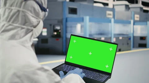 Green screen laptop, tracking semiconductor fabrication lots and technician Stock Footage 333394152