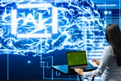 Green screen laptop used by admin to do maintenance on neural networks Stock Photos