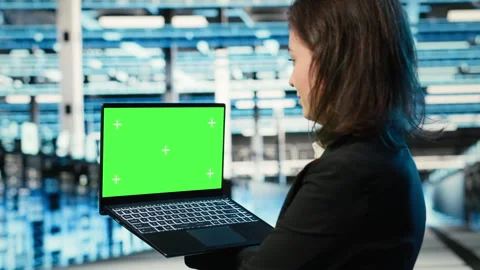 Green screen laptop used by data center developer to monitor industrial systems Stock Footage 329324031
