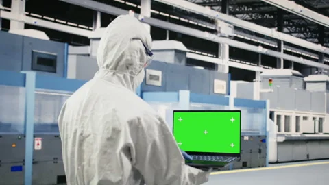 Green screen laptop used by microchip factory engineer monitoring gear Stock Footage 333391842