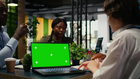Green screen laptop used by tech startup office programmers doing meeting Stock-Footage 323238347