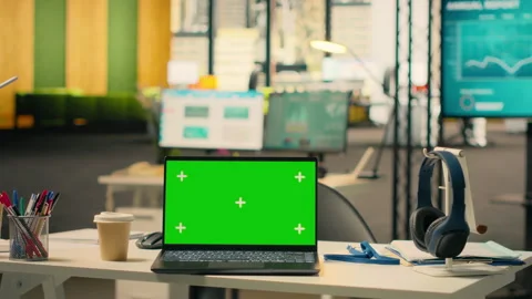 Green screen laptop at workstation in empty bright open office Stock Footage 329325486