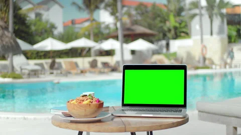 Green screen macbook display. Chroma key laptop near swim pool. Computer monitor Stock Footage 246407447