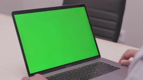Green Screen on Macbook Pro with Man's Hand Stock Footage 134564675