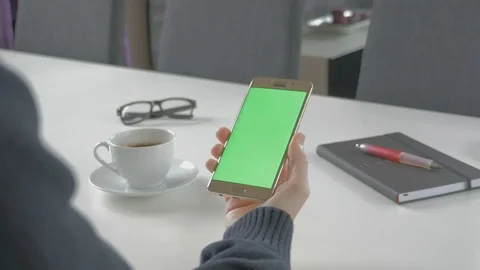 GREEN SCREEN man watching on his mobile phone Stock Footage 83220857