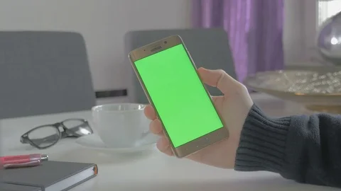 GREEN SCREEN man watching on his mobile phone Stock Footage 83221429