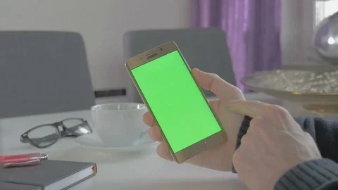GREEN SCREEN man watching on his mobile phone Stock Footage 83221820