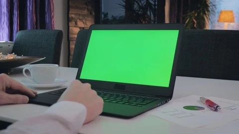 GREEN SCREEN man working on his laptop Stock Footage 98213439