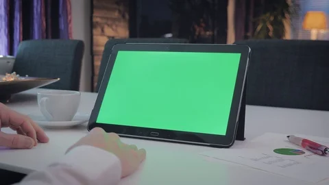 GREEN SCREEN man working on his tablet pc Stock Footage 98213545