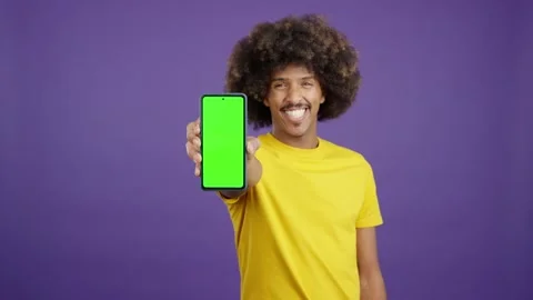 Green screen of the mobile held by an african man 動画素材 234857215