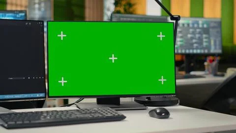 Green screen mockup computer monitors in empty startup workspace Stock-Fotos