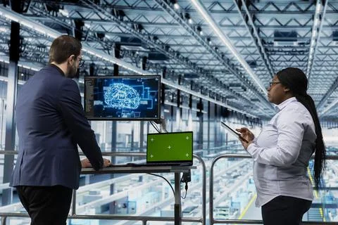 Green screen mockup laptop in microchip factory and AI used by workers Stock Photos