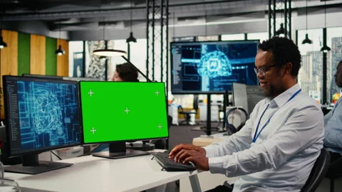 Green screen mockup PC used by data scientist in office automating with AI Stock Footage 323032451