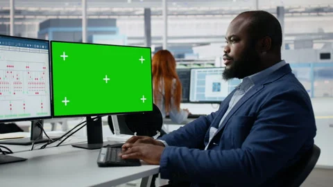 Green screen mockup PC used by man in semiconductors factory office Stock Footage 335882233