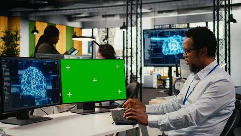 Green screen mockup PC used by data scientist in office automating with AI Foto stock