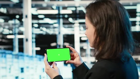 Green screen mockup smartphone used by server hub worker watching videos Stock Footage 329323364