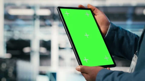 Green screen mockup tablet in server room used by worker to enhance hardware Stock Footage 330376402
