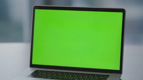 Green screen monitor laptop standing on office desk closeup. Chroma key computer Stock Footage 228250744