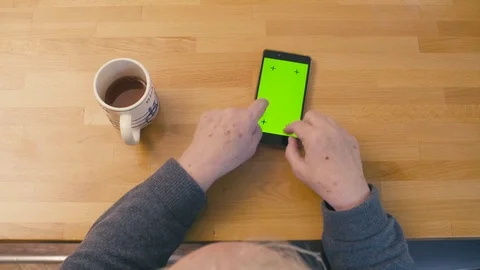 Green screen. Old woman typing in smartphone Stock Footage