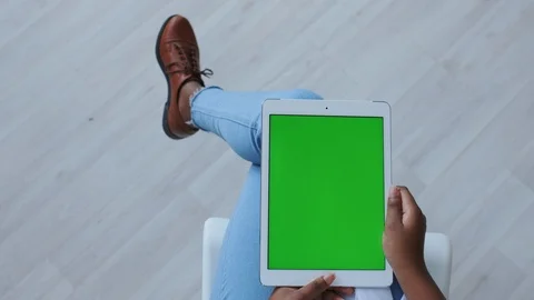 Green Screen or Mock-up Tracking in African American Girl Hands. Using Portable Stock Footage 121098821