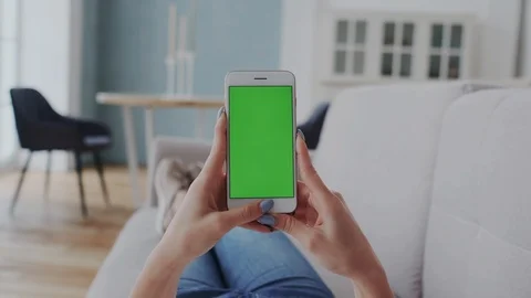 Green Screen or Mock-up Tracking Touchpad on Smartphone. Young Woman Lying on Stock Footage 122417195