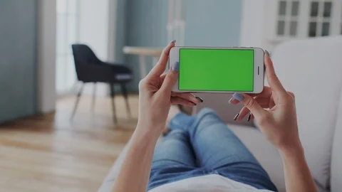 Green Screen or Mock-up Tracking Touchpad on Smartphone. Young Woman Lying on Stock Footage 122417258