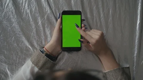 Green screen. Over the shoulder shot of young Caucasian female with long black 動画素材 104335395