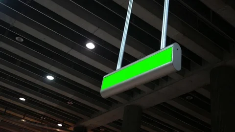 Green Screen overhead sign in underground modern subway station ALT Stock Footage