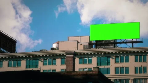 Green Screen Panel Over Urban Rooftop Under Blue Sky Stock Footage 318610625