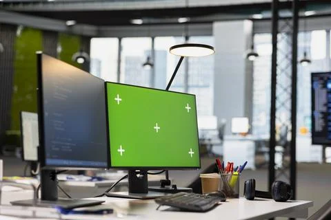 Green screen PC in AI startup workspace leveraging machine learning technology Stock Photos