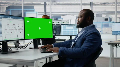 Green screen PC, analyzing PCB architecture and man in semiconductors factory Stock Footage 335882282