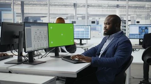 Green screen PC, analyzing PCB architecture and man in semiconductors factory Stock Photos