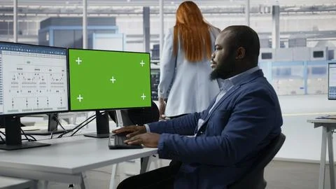Green screen PC, analyzing PCB architecture and man in semiconductors factory Stock Photos