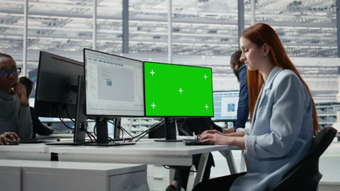 Green screen PC, coding and woman in microchip factory office Stockbeeldmateriaal 335880499
