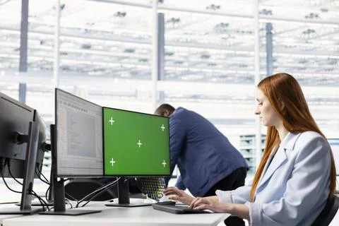 Green screen PC, configuring PCB electronic hardware setups and woman Stock Photos