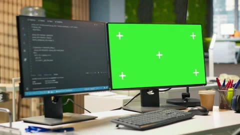 Green screen PC display on startup office desk showing programming languages Stock Footage 313014888