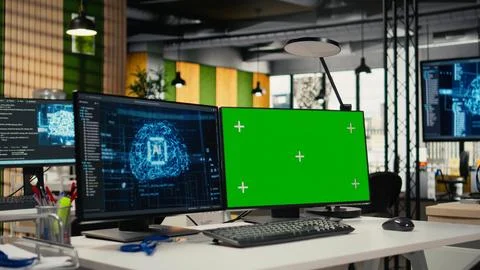 Green screen PC in empty startup office with artificial intelligence program 库存照片