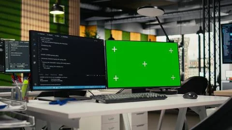 Green screen PC in empty startup office with programming language script 스톡 사진