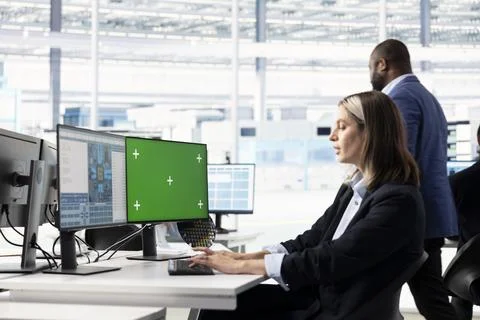 Green screen PC, modeling integrated circuit systems and woman in RD office Stock Photos