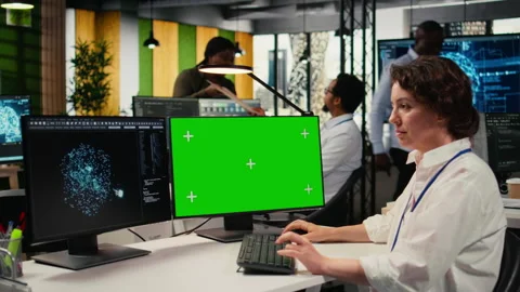 Green screen PC used by technician in office using AI to optimize systems 스톡 동영상 323143983