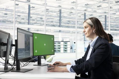 Green screen PC used by yield enhancement engineer tracking microchip defects Stock Photos